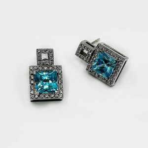 Boucle d'oreille or 18k 7.21grs topaze bleue 4 crt